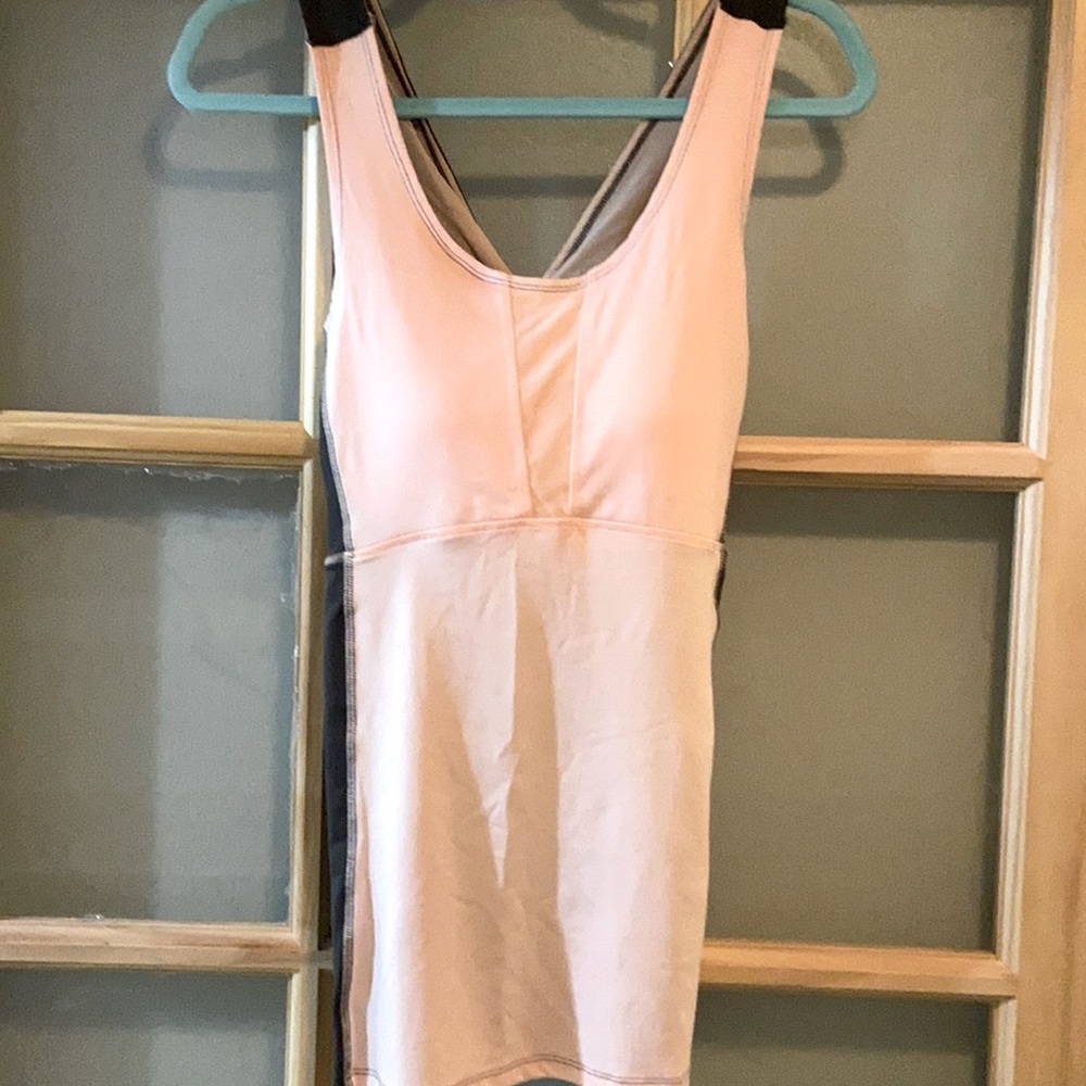 We are selling  a grey and pink tank top.